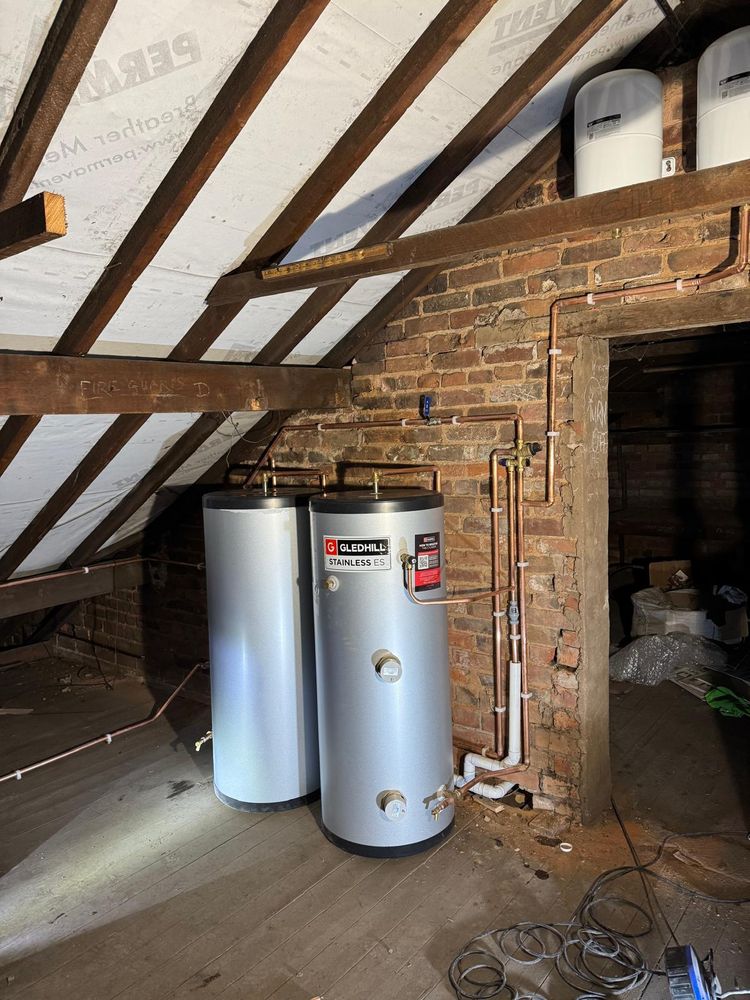 Unvented hot water cylinders installed in a loft